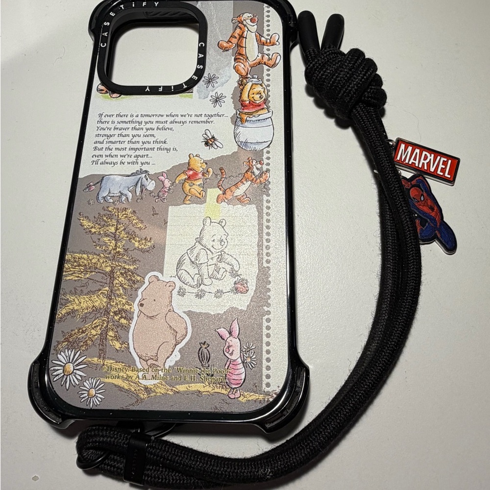 CASETiFY Winnie the Pooh, Tigger case for iPhone 15 Pro Max.
 & CASETiFY Strap